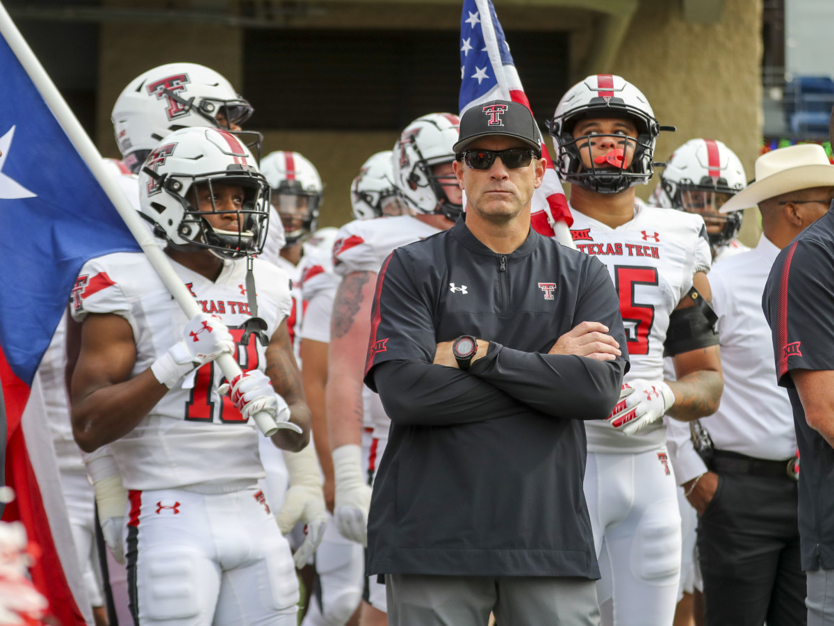 Texas Tech Red Raiders head coach Matt Wells leads his team onto the field prior to their game against the West Virginia Mountaineers at Mountaineer Field at Milan Puskar Stadium.